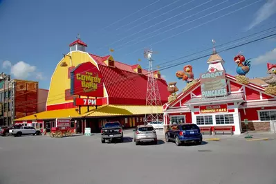 Comedy Barn Theater in Pigeon Forge next to Frizzle  Chicken Farmhouse