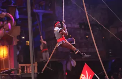 pirate performer hanging on rope
